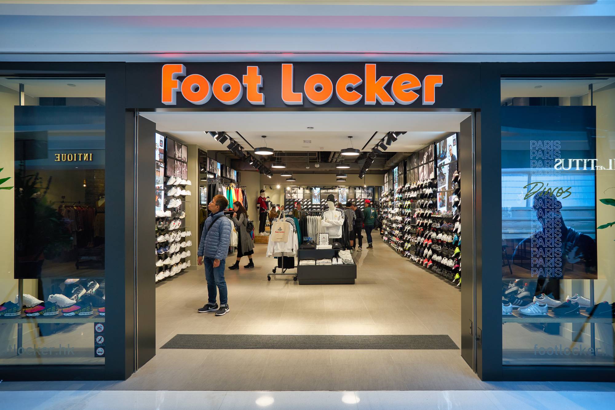 Looking inside a Foot Locker store in Hong Kong where shoppers are browsing