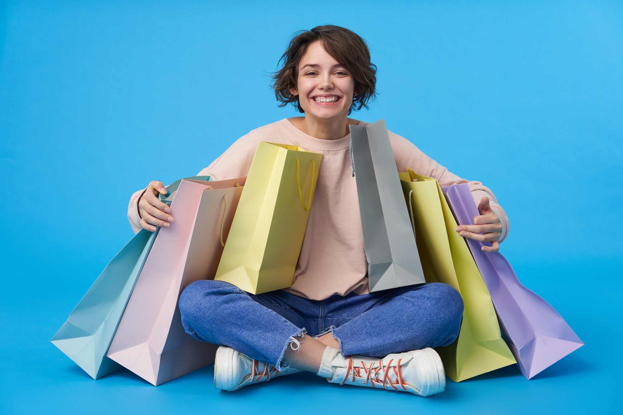 Short woman with bags of shopping