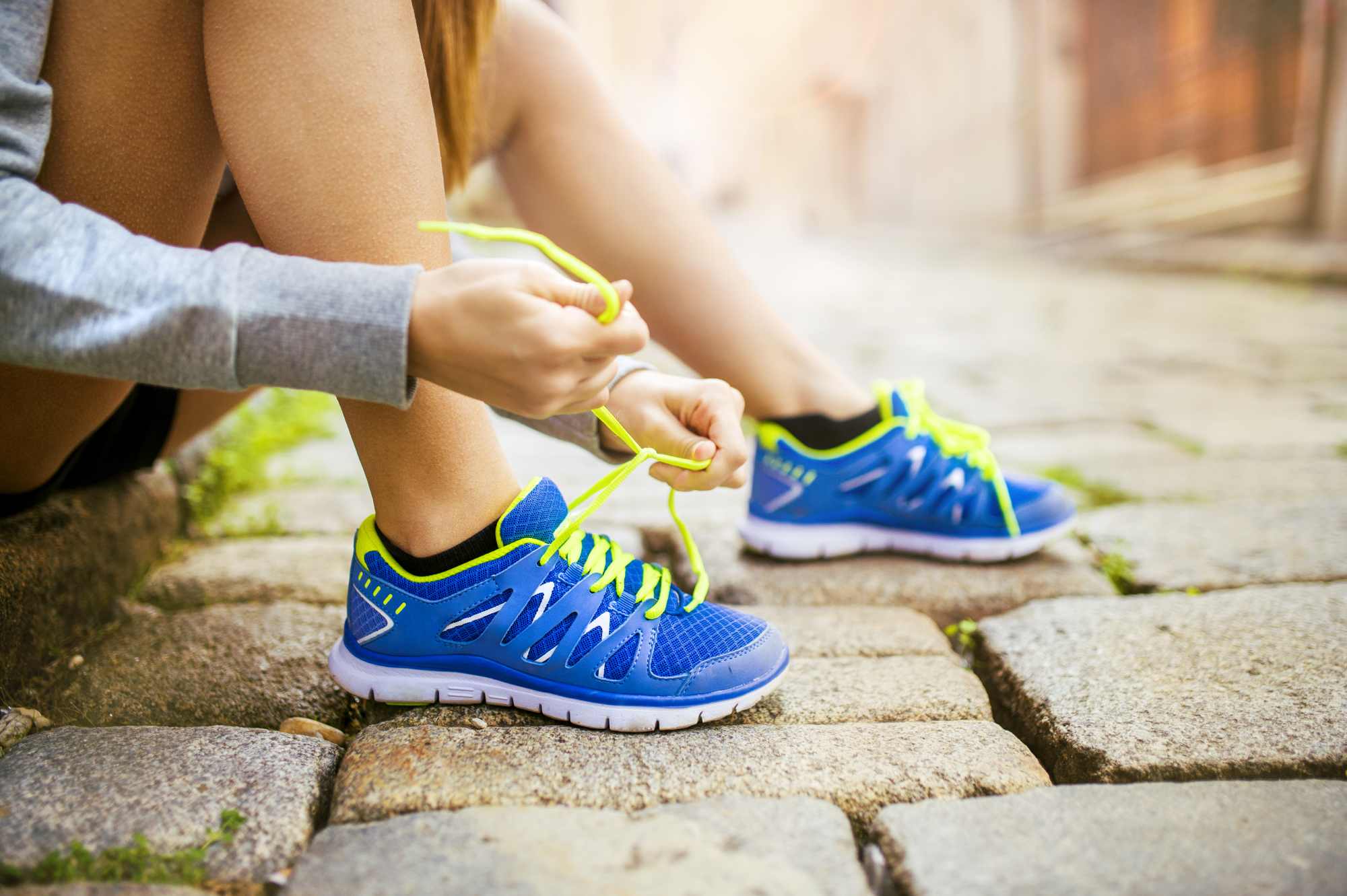 jogger tying running shoes