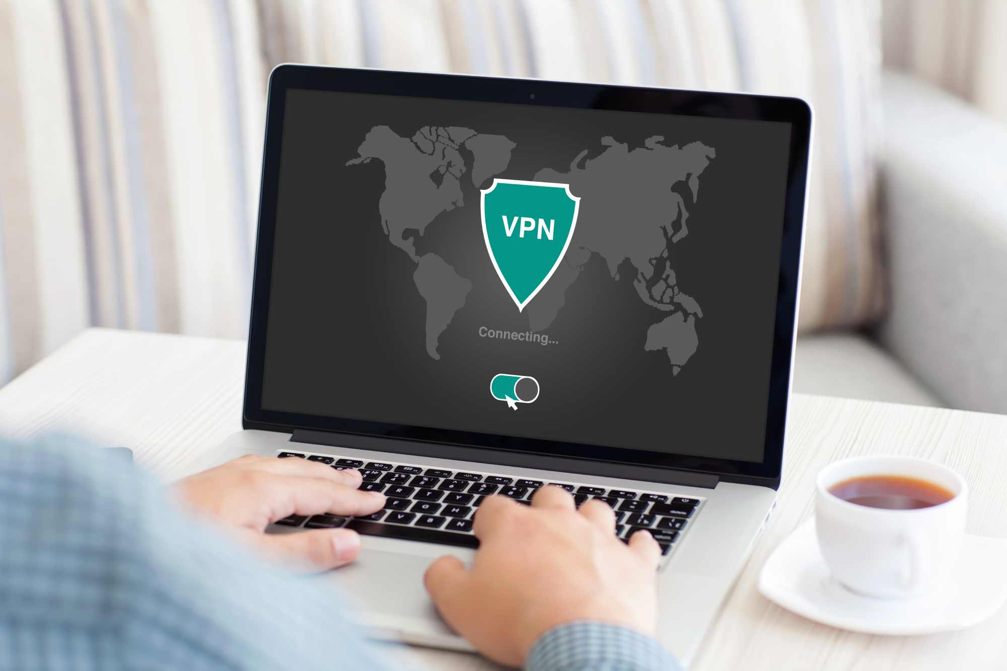 man using a vpn on his laptop