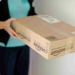 woman getting an amazon package delivered